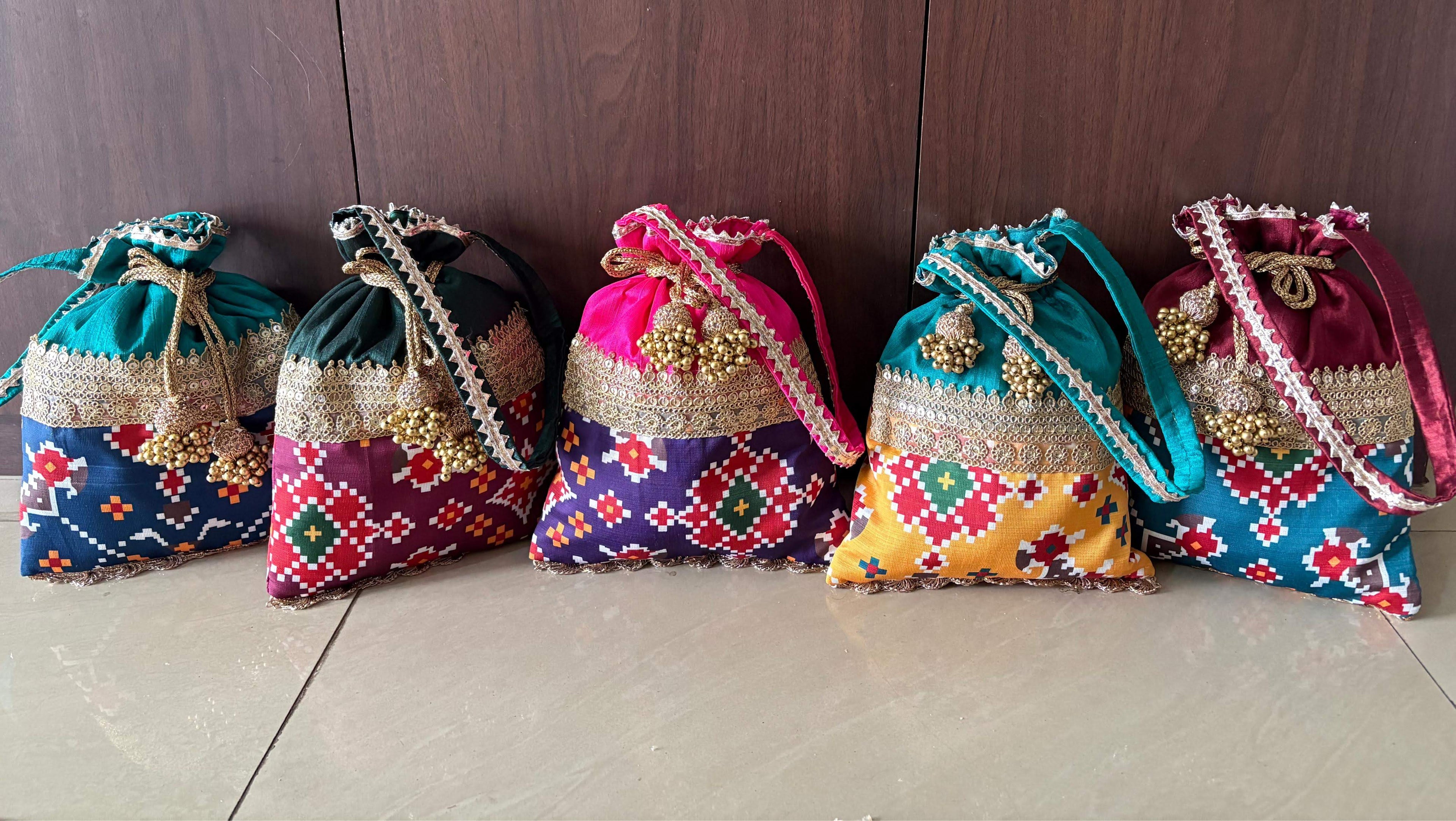 Dual fabric Patola Potlis